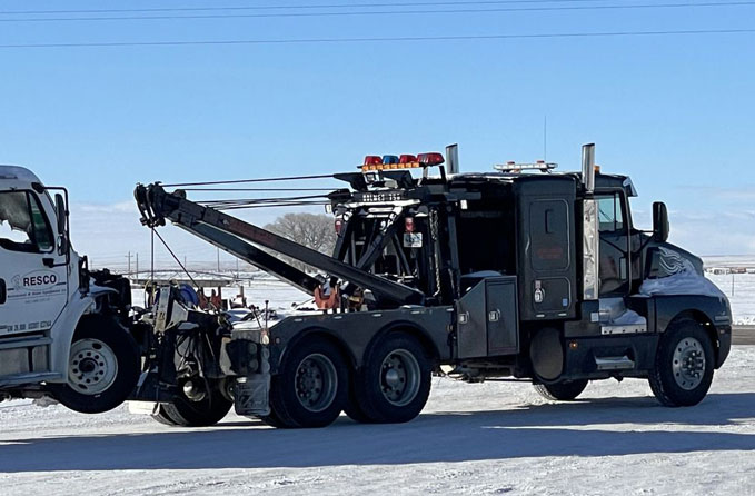 Semi-Towing Neufer's towing a wrecked semi