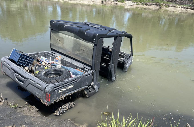 stuck-Side-By-Side Stuck side by side atv in a river.